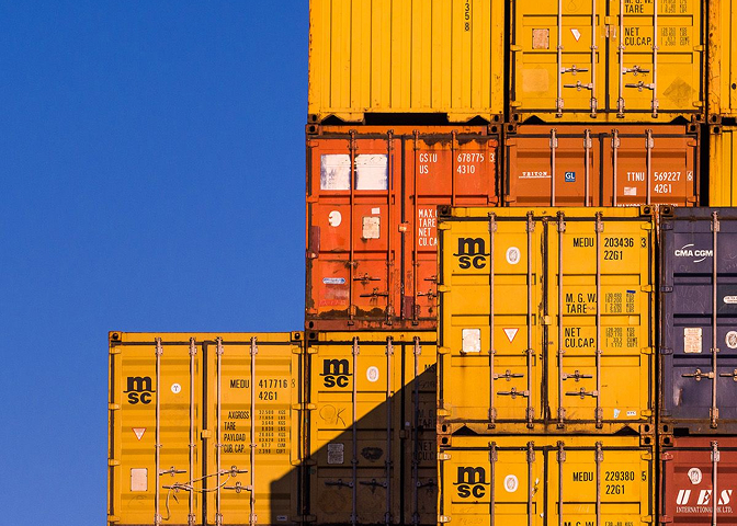Stack of yellow shipping containers